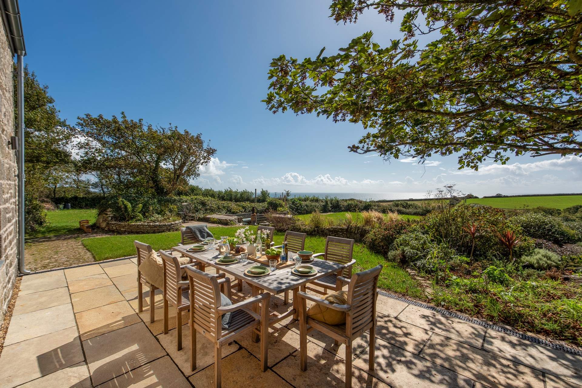 The patio has glimpses of the ocean.