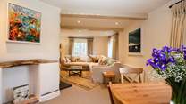 The dining-area leads neatly into the main sitting-area.