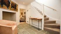 The two floors are linked by this spacious ground floor hallway.