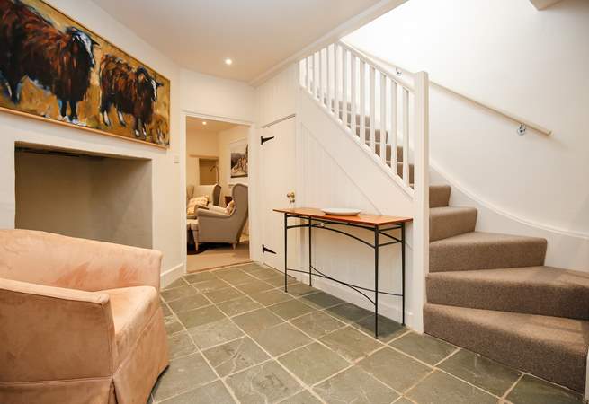 The two floors are linked by this spacious ground floor hallway.