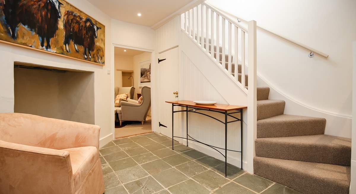 The two floors are linked by this spacious ground floor hallway.