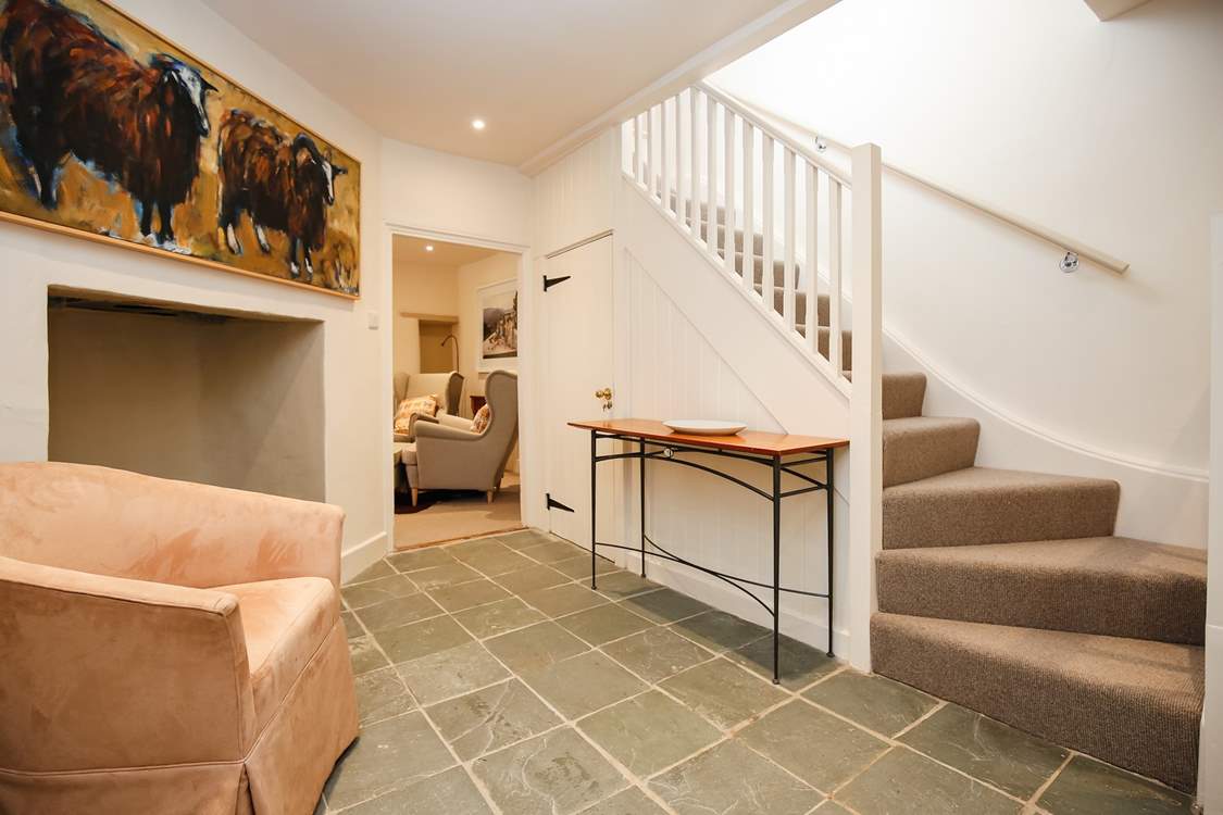 The two floors are linked by this spacious ground floor hallway.
