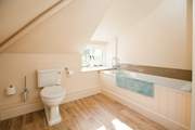 The family bathroom is rather spacious. Perfect for bathing the little ones.