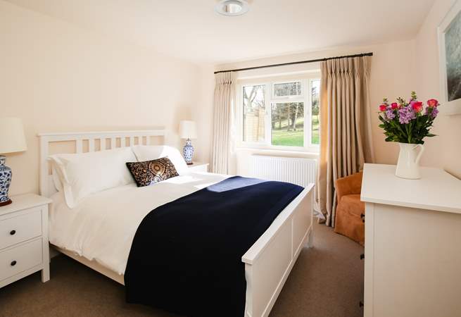Bedroom 1 is home to this king-size bed and wonderful countryside views.