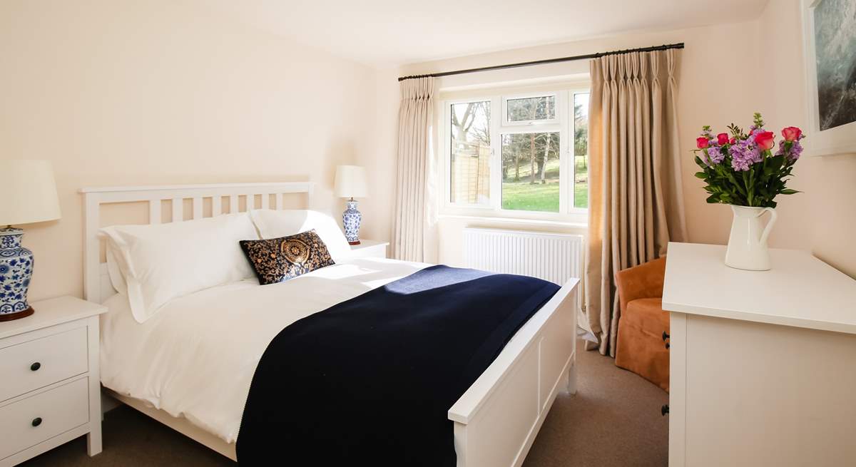 Bedroom 1 is home to this king-size bed and wonderful countryside views.