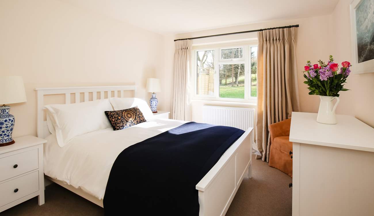 Bedroom 1 is home to this king-size bed and wonderful countryside views.