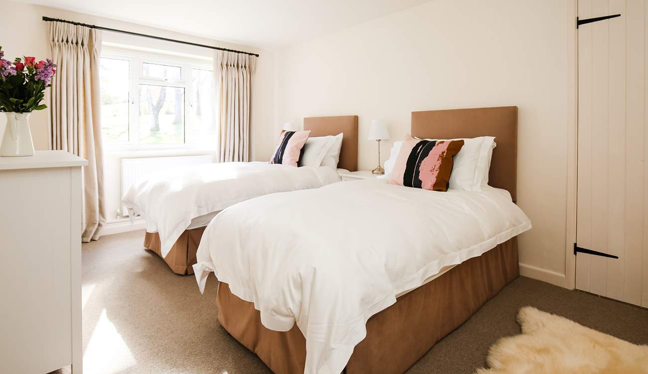 Bedroom 2 offers this sumptuous twin bed set-up.