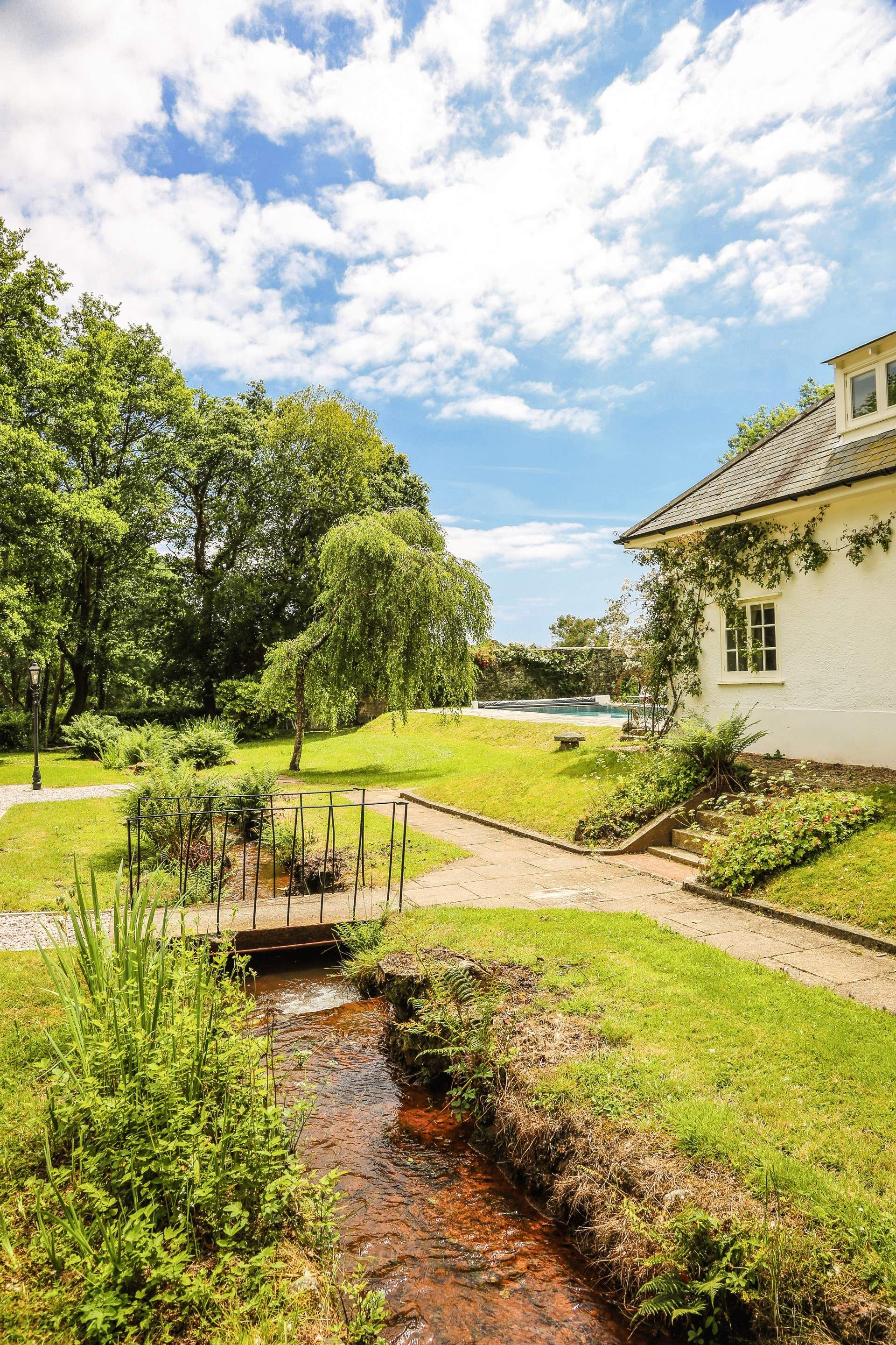 Please be mindful of little ones when crossing the stream and playing in the extensive grounds.