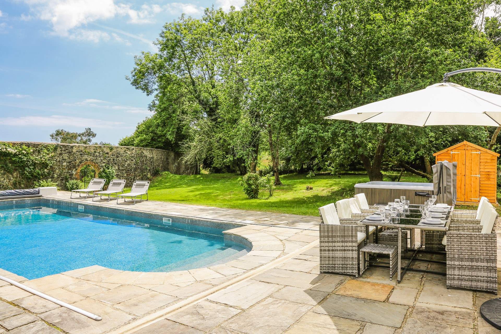 Step out onto the patio-area, where you will be greeted by a bubbling hot tub, glorious heated swimming pool and a fabulous area of lawn for the little ones to let off steam.