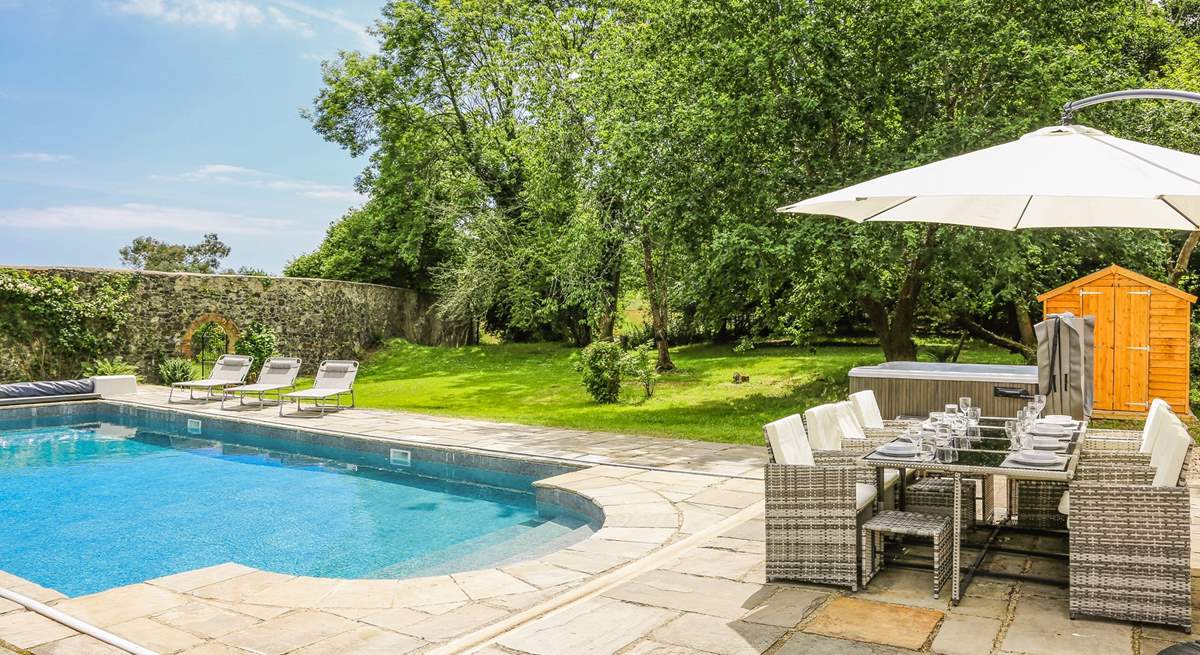 Step out onto the patio-area, where you will be greeted by a bubbling hot tub, glorious heated swimming pool and a fabulous area of lawn for the little ones to let off steam.
