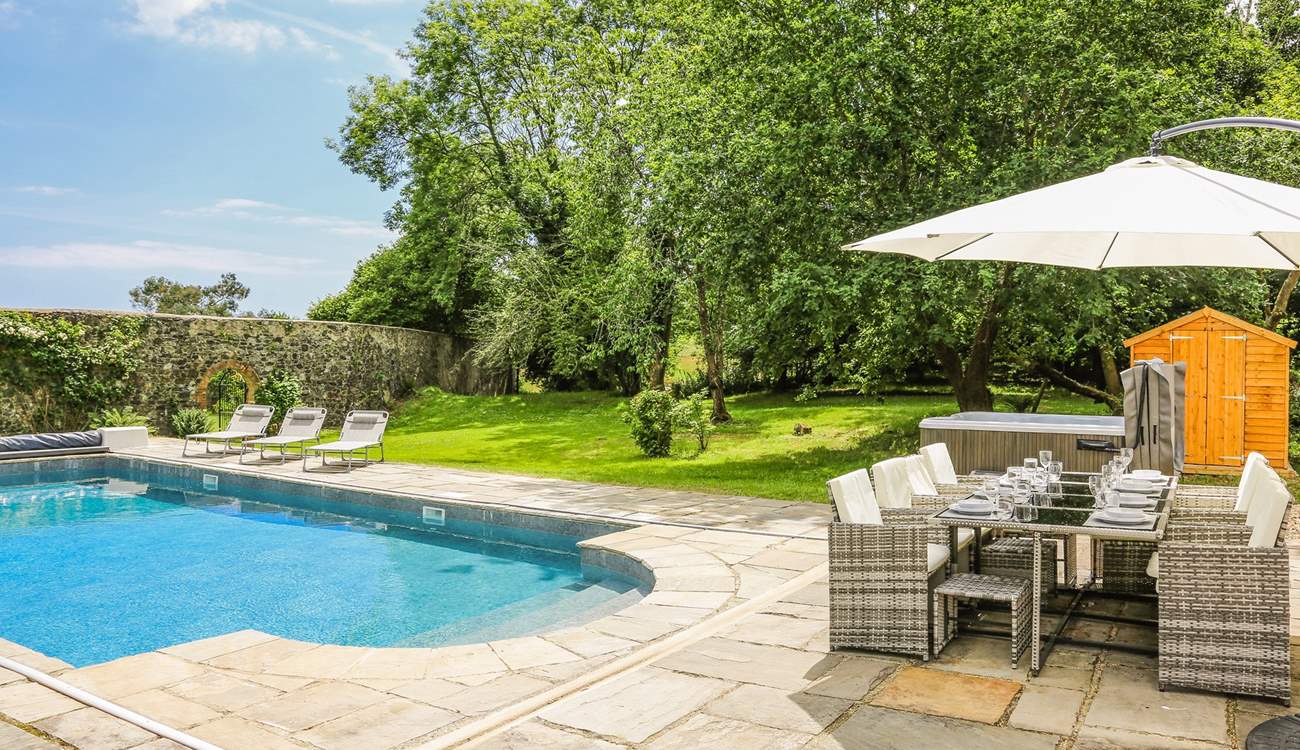 Step out onto the patio-area, where you will be greeted by a bubbling hot tub, glorious heated swimming pool and a fabulous area of lawn for the little ones to let off steam.