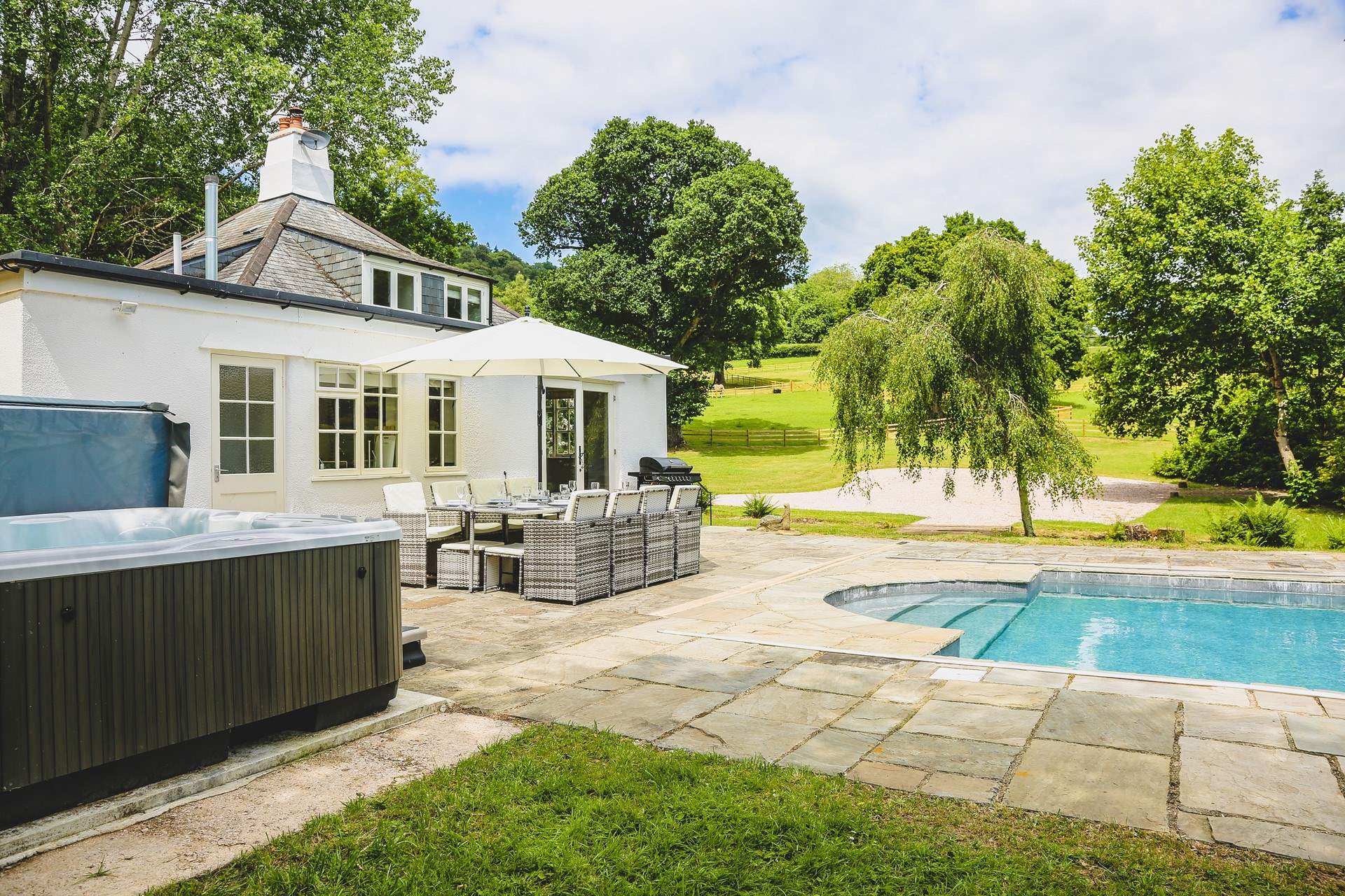 The glorious swimming pool, hot tub and superb rolling countryside setting makes holidaying at this beautiful cottage rather special.