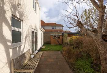 A small patio and garden area sits behind the house. New garden furniture and photos to follow.