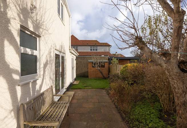 A small patio and garden area sits behind the house. New garden furniture and photos to follow.
