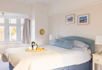 This spacious king-size double bedroom is a nice place to retreat at the end of the day.