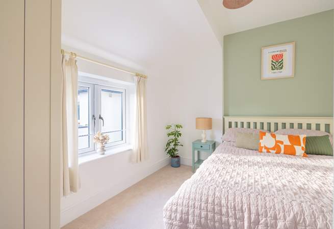 Enjoy peaceful sleeps in this relaxing double bedroom.