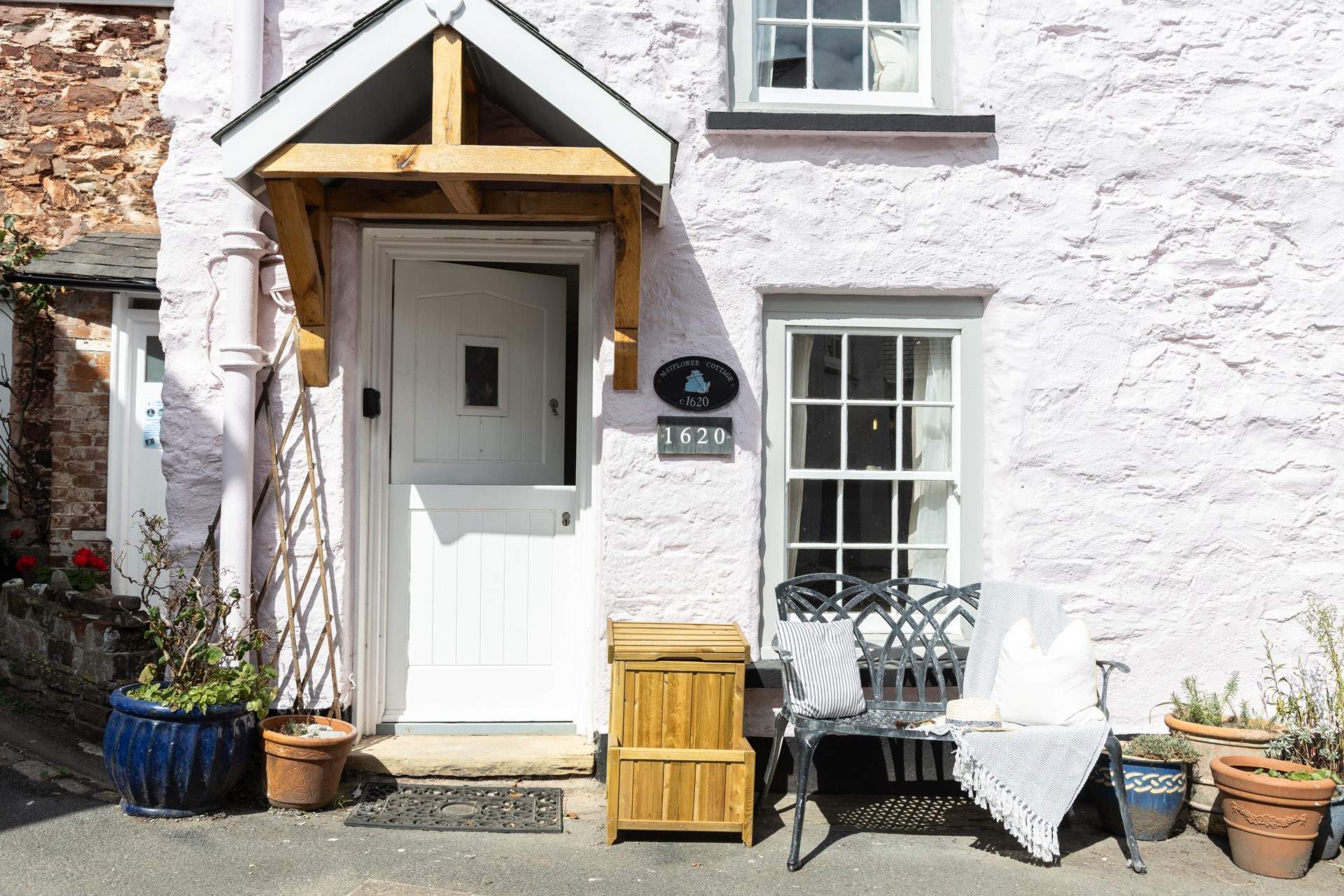 On sunnier days, enjoy a morning cuppa on the bench at the front of the cottage.