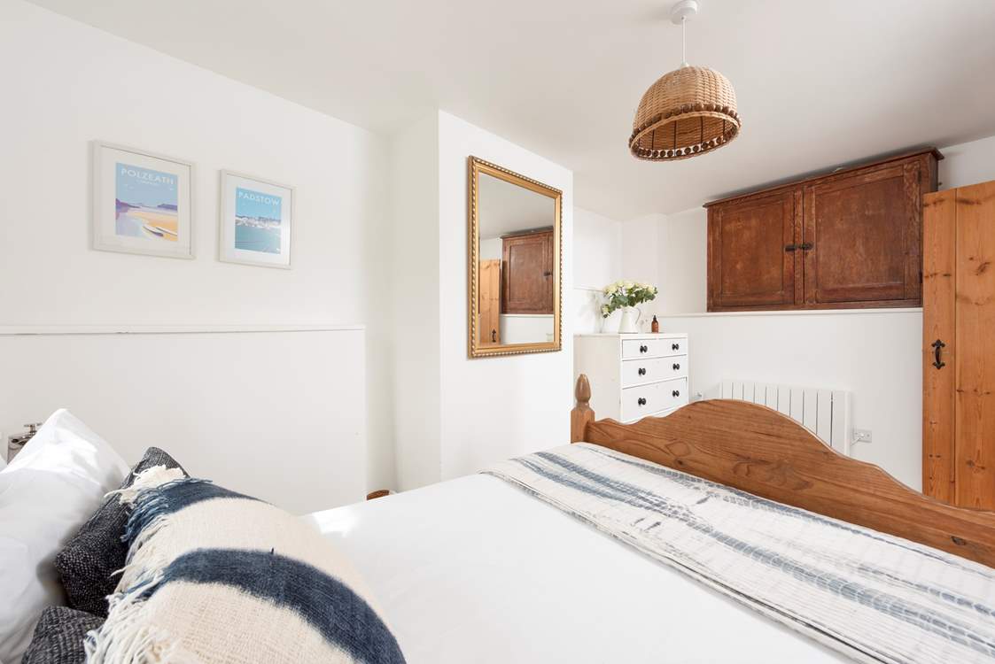 This lovely bedroom has a comfy double bed.