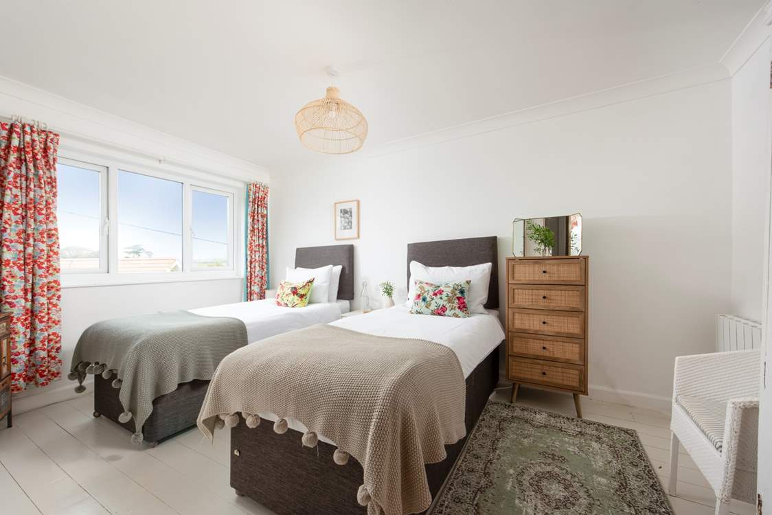 This twin bedroom has beautiful views over the rolling countryside (bedroom 2).