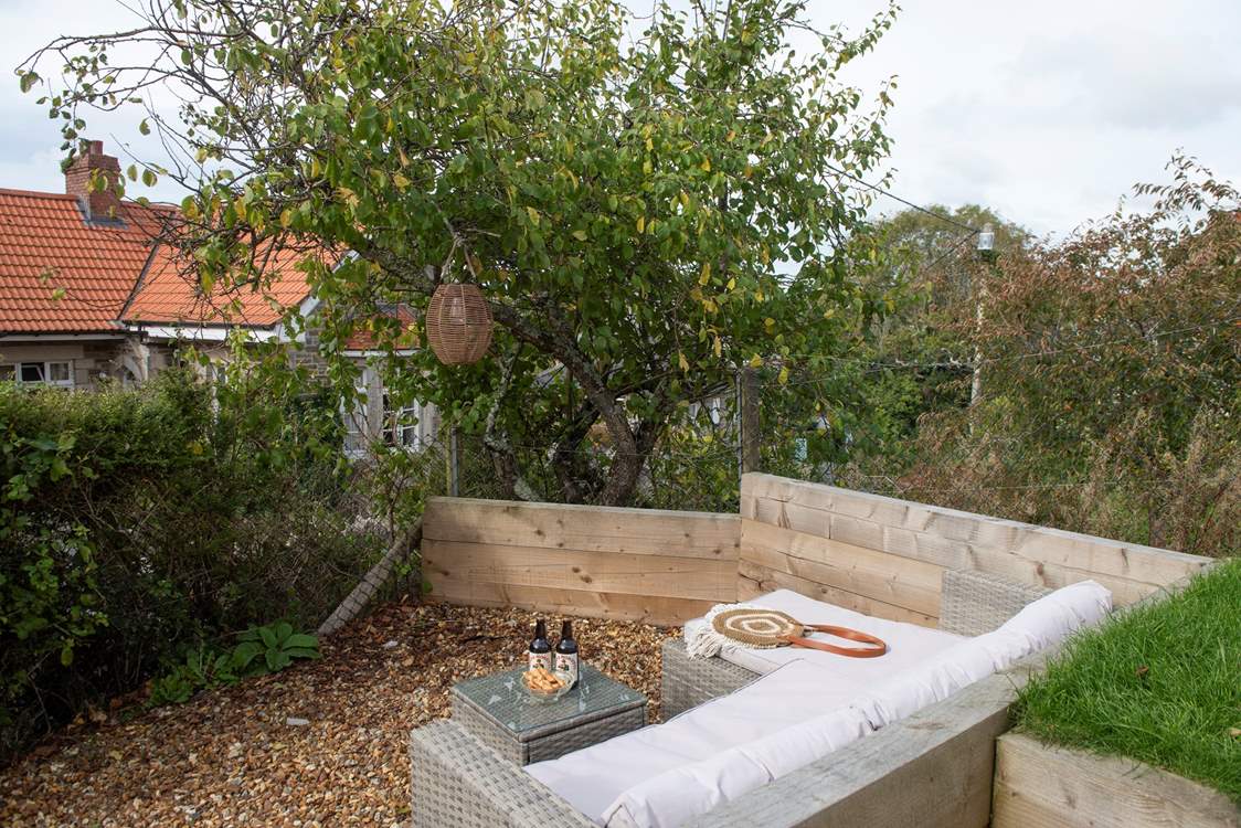 Kick back and relax on the outside sofa under the solar lanterns and watch the stars come out.