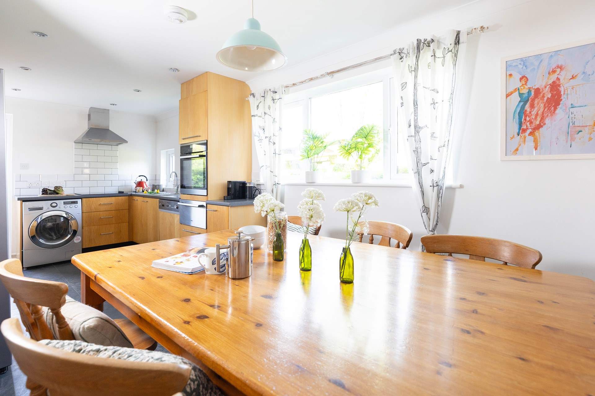 The large farm house table is the perfect place for long relaxing meals.