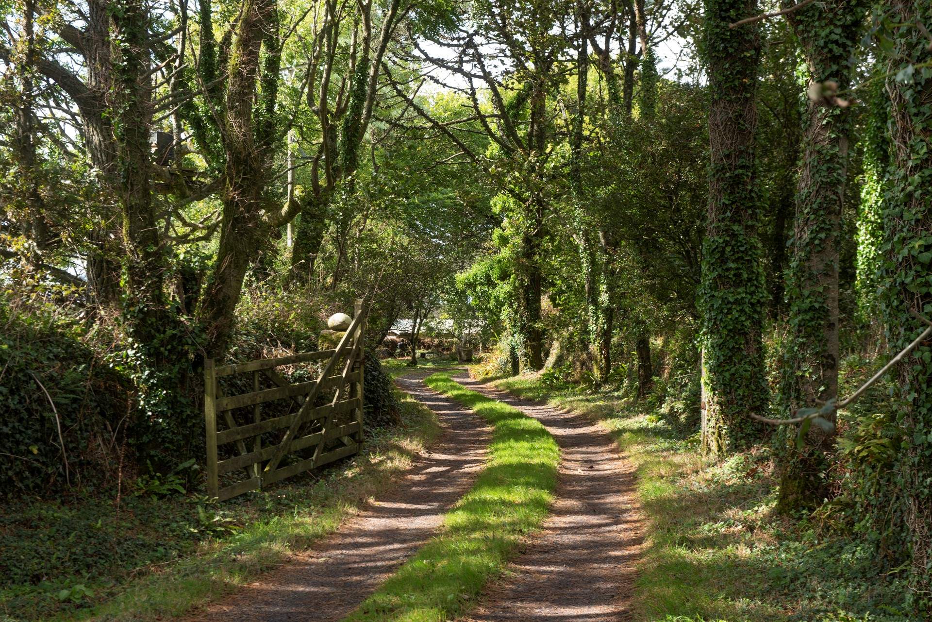 The entrance is a short way along a private lane.