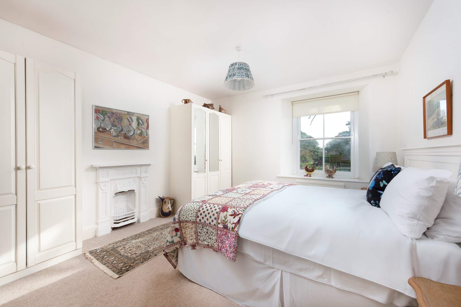 Relax in spacious bedroom 1, with its super-king 'zip and link' bed, en suite shower-room, garden views and tasteful touches with the owners' pottery.