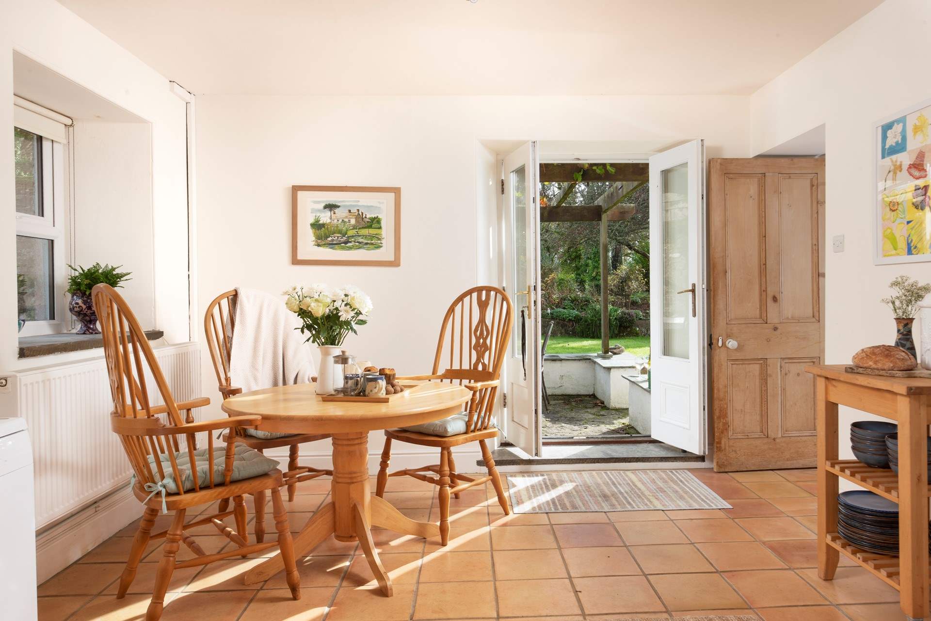From the kitchen, double doors open onto the garden and patio.