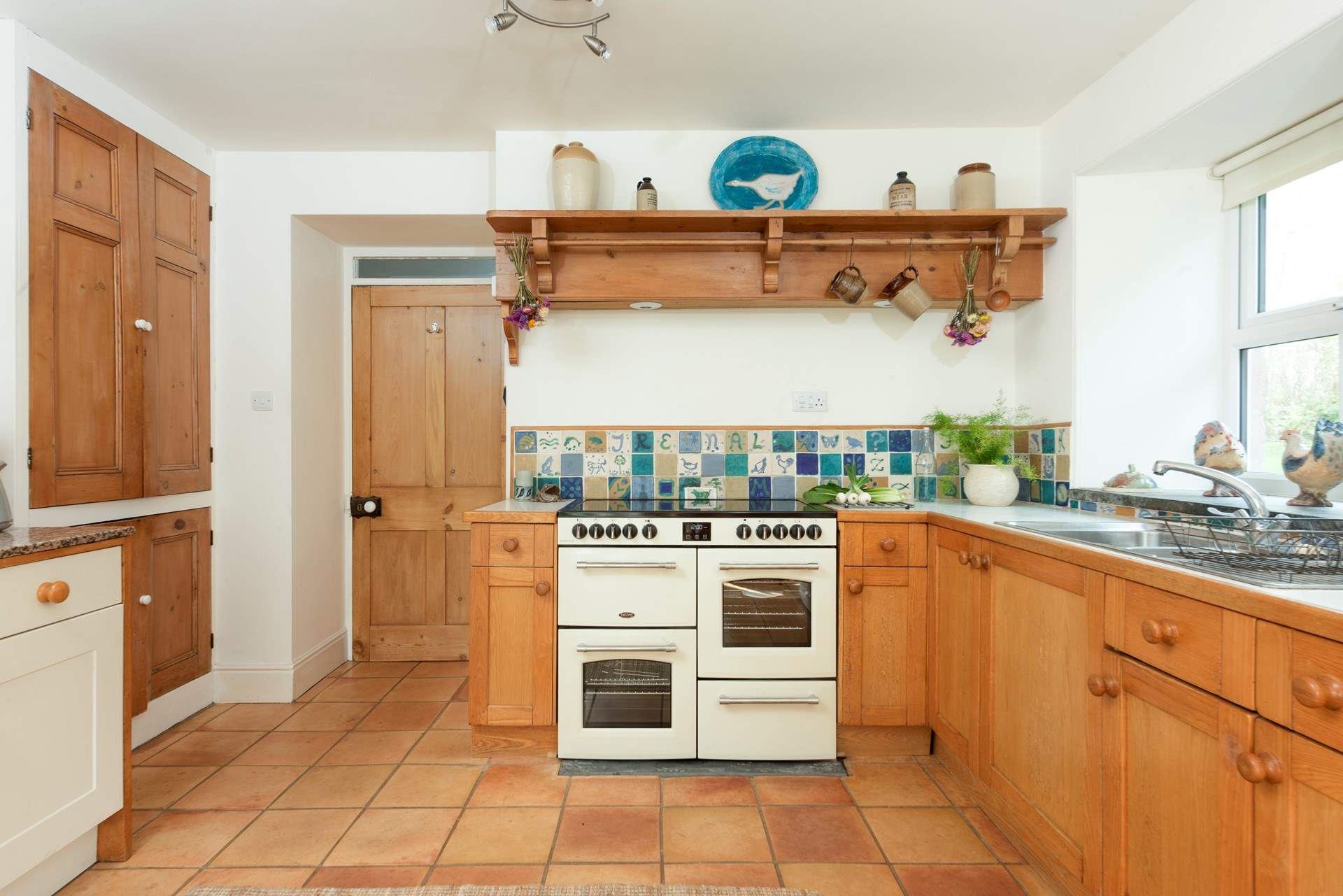A warm farmhouse kitchen full of Cornish character.