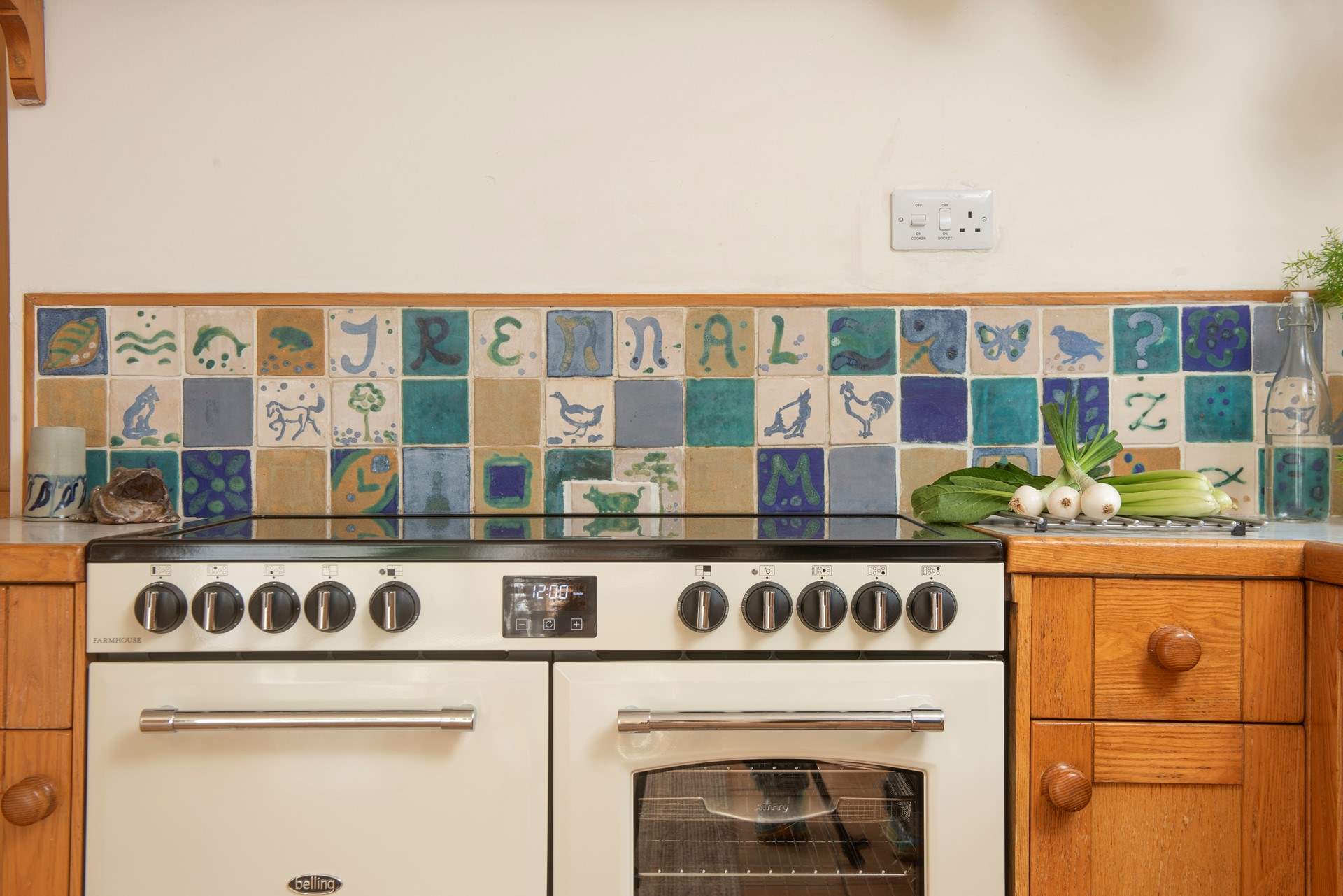 There are original tiles, hand-made by the owners, in the kitchen - the heart of this lovely farmhouse.