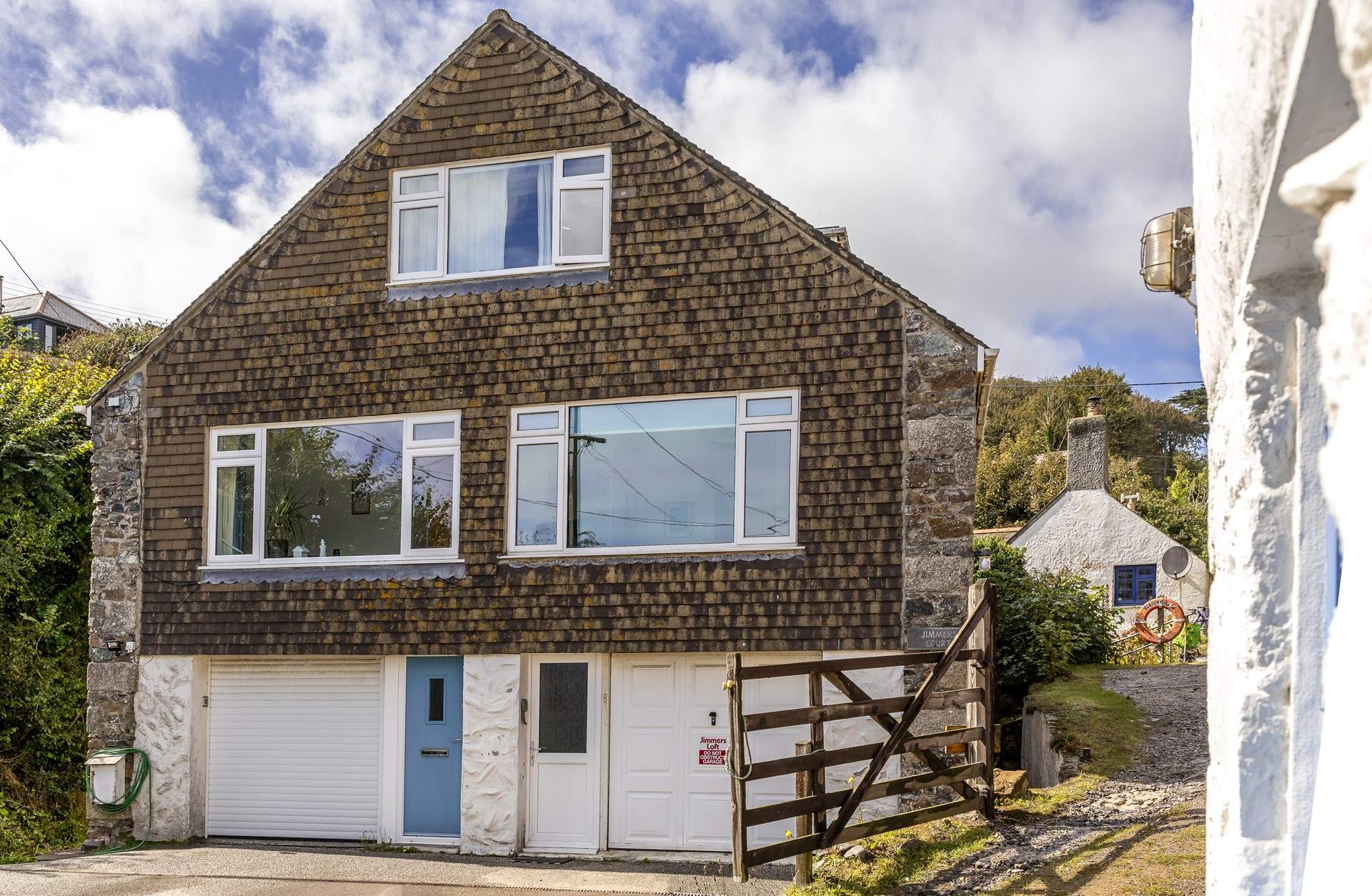 Converted from a traditional Cornish pilchard loft, Tea By The Sea is the apartment on the right.