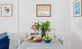 The dining-area has space for all guests to gather around. - Thumbnail Image