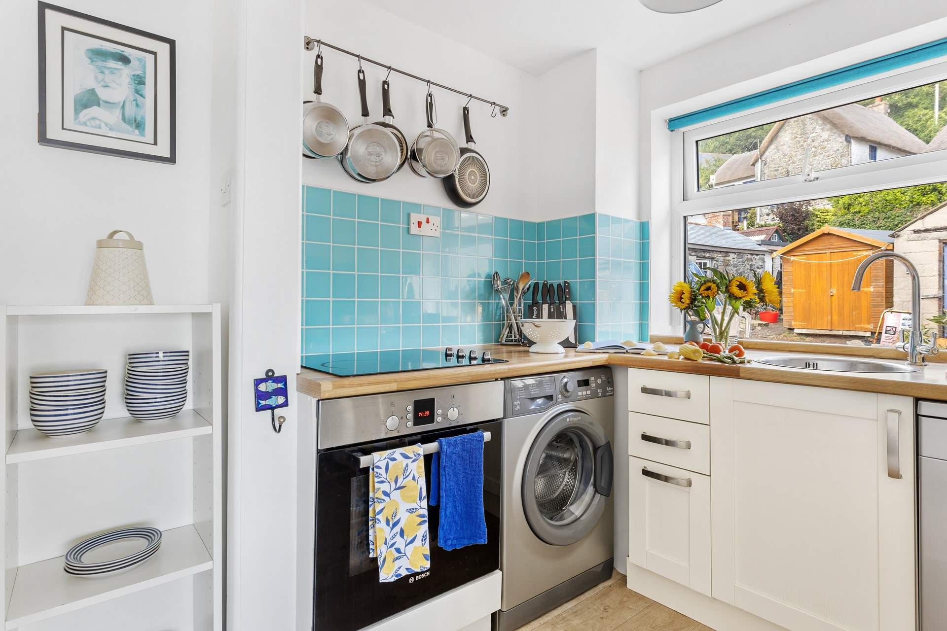 The compact kitchen is equipped for family meals.