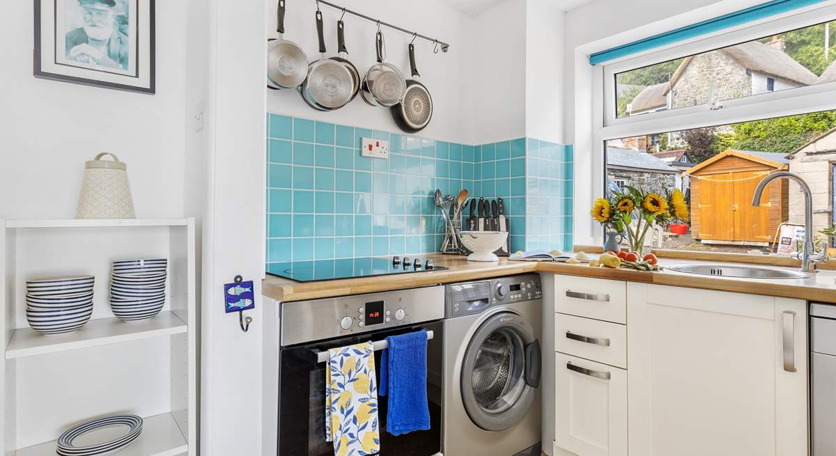 The compact kitchen is equipped for family meals.