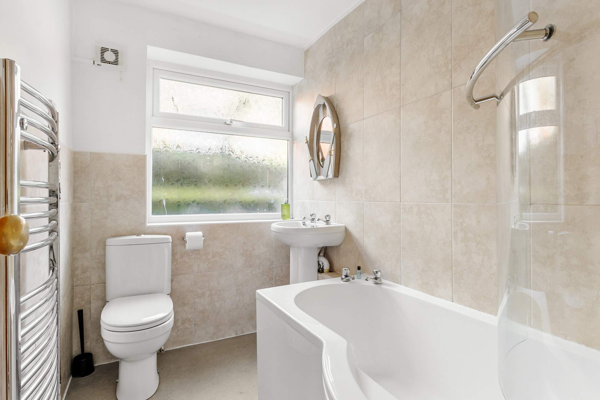 The family bathroom is on the ground floor and is complete with a heated towel rail.