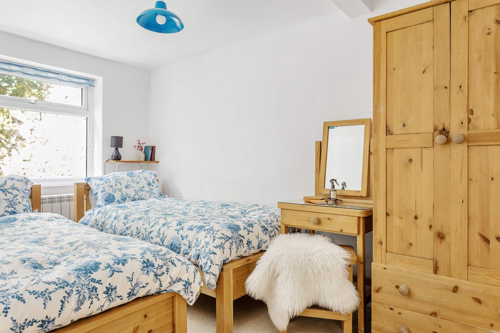 The twin room on the ground floor has solid wooden beds.