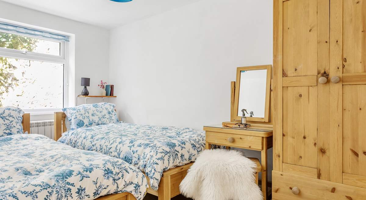 The twin room on the ground floor has solid wooden beds.