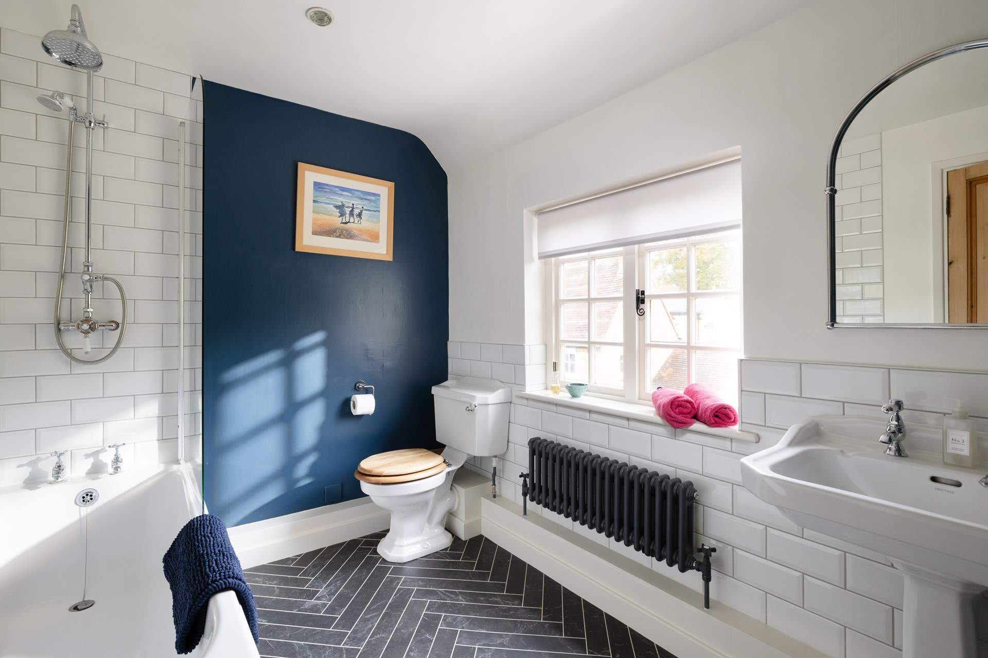 The bathroom is spacious and the bath is just the place for a long, relaxing soak after a day in the Cotswolds. 