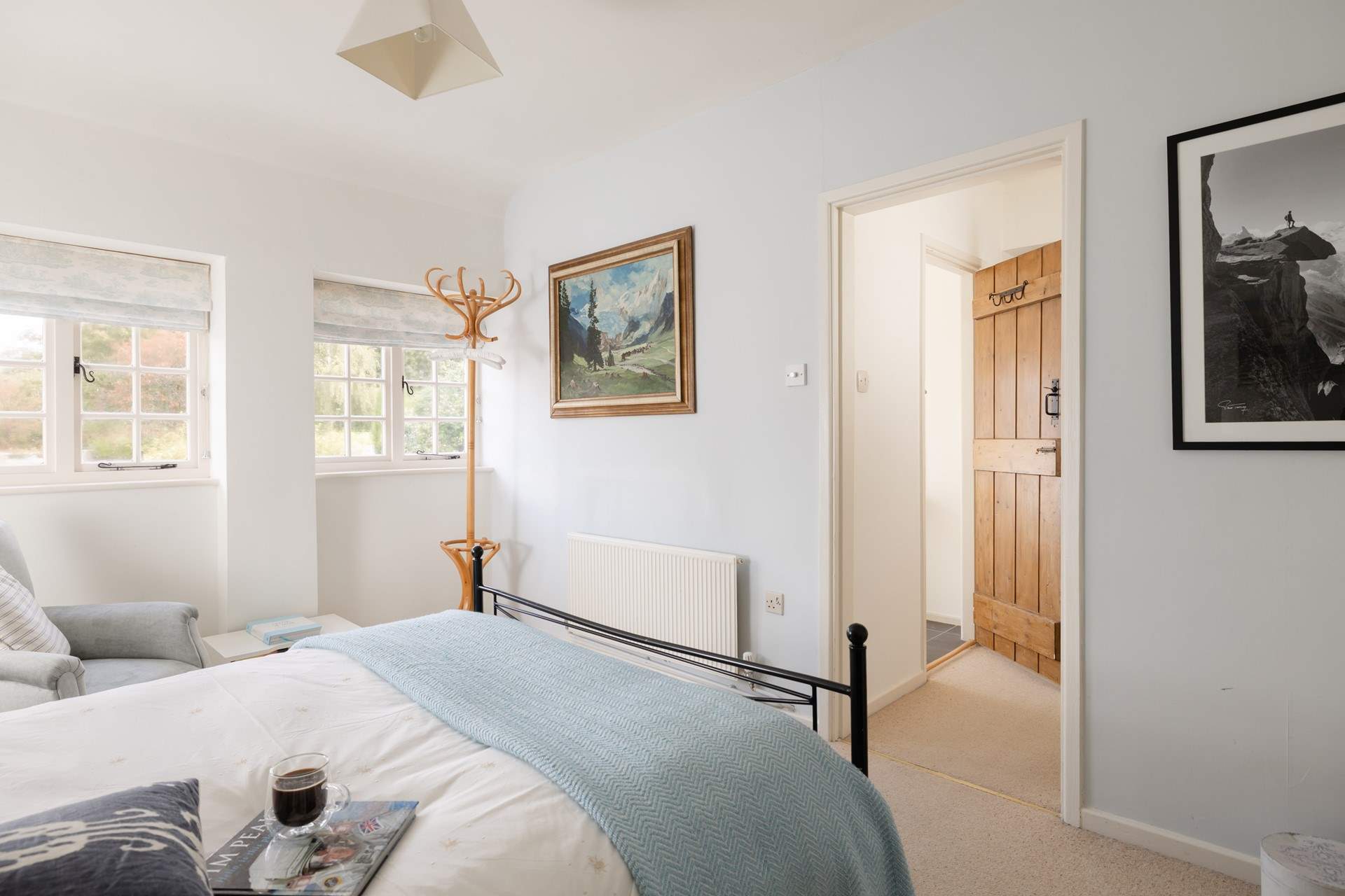 The sun shines in through the windows and bathes the room in dappled sunlight. 