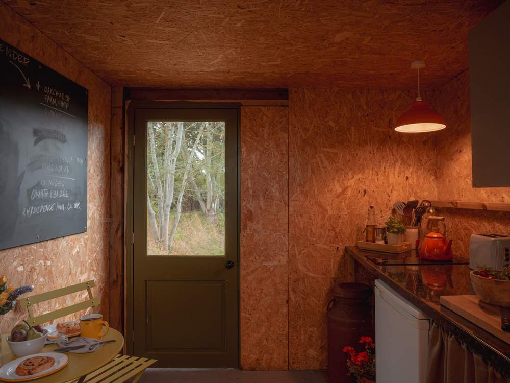 Complete with an electric hob, fridge, toaster, utensils and more.