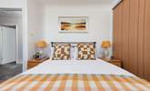 Relax in inviting king-size bedroom 1, designed for comfort and a restful night's sleep. - Thumbnail Image