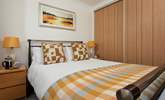 Sink into the king-size bed with luxury linens. - Thumbnail Image