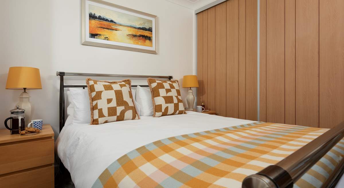Sink into the king-size bed with luxury linens.