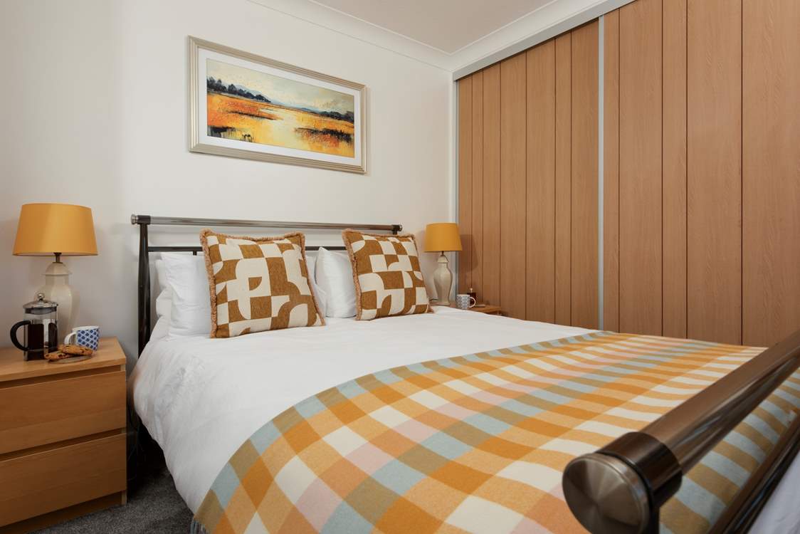 Sink into the king-size bed with luxury linens.