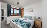 Bright and airy, this bedroom is the perfect place to unwind. - Thumbnail Image