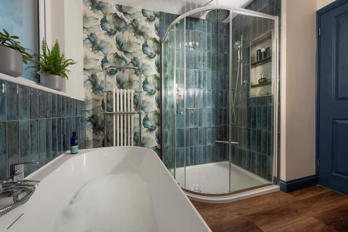 The family bathroom with elegant freestanding bath and invigorating shower, has been beautifully designed by the current owners.