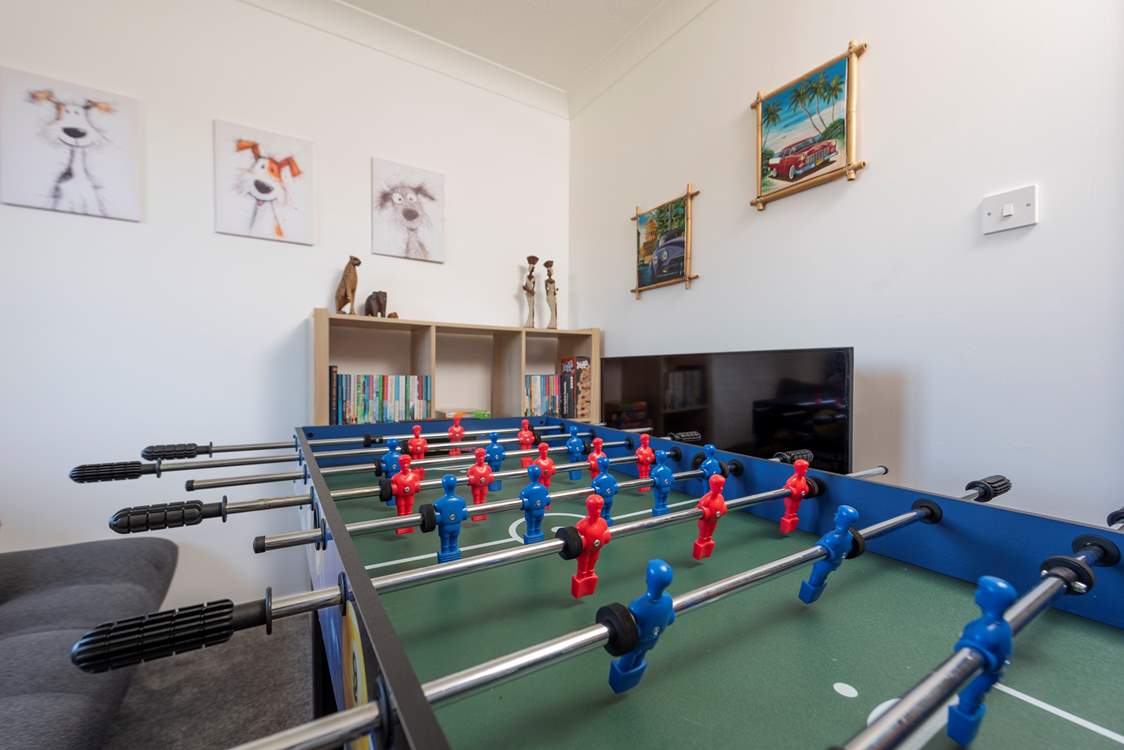 Family fun, in the sweet games-room, with multi games table and Smart TV.