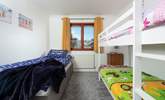 Bedroom 3 welcomes three guests in the bunk-beds and a separate single bed. - Thumbnail Image