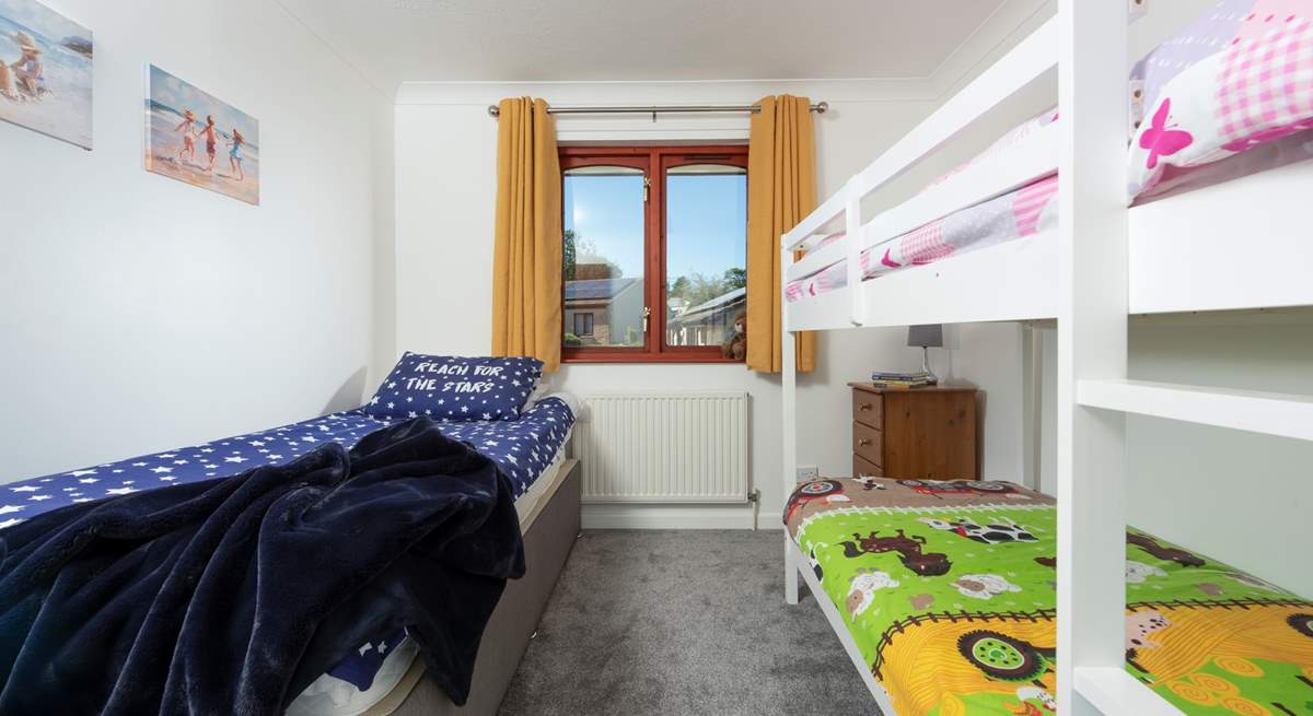 Bedroom 3 welcomes three guests in the bunk-beds and a separate single bed.