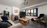 Cosy up in the sitting-room by the ornamental fire or unwind with your favourite shows on the Smart TV. - Thumbnail Image